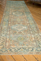 Vintage Karaja runner's distressed geometric floral vinery in soft blue, gold, and ivory.