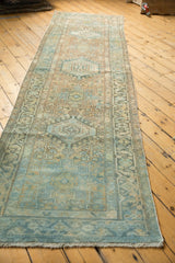 Distressed pile texture, fringe, and geometric floral patterns of a Karaja rug runner.