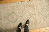 Distressed vintage Serab runner showing even wear, foundation visible, geometric patterns in muted beige, sea foam.