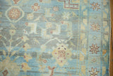 Malayer rug corner with playful geometric floral patterns, powder blue, saffron gold abrashes.