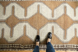 Gabbeh rug's faded copper and antique ivory geometric pattern, small diamonds.