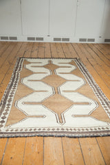 Antique ivory and faded copper brown geometric Gabbeh pattern with charcoal diamond border.