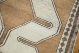 Vintage Gabbeh rug detail: small charcoal diamond motifs on the inner border.