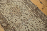 Textured antique ivory and charcoal geometric motifs on a vintage Hamadan runner.