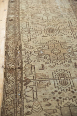 Textured antique ivory and chocolate geometric border of the distressed Hamadan runner.