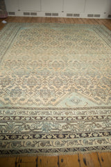 Distressed Mir Serbend border of a vintage Malayer carpet, with sand, aqua, and chocolate tones.
