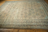 Decorative distressed Malayer carpet with softened sand, beige, and powder blue Herati pattern.