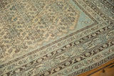 Distressed Malayer carpet detail: Herati motif, Mir Serbend border, sand, pale blue, brown.
