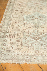 Geometric vinery in faded pale silver, brown, and ivory on a vintage Karaja runner.