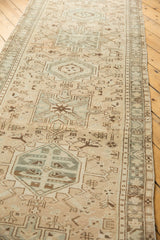 Distressed Karaja rug runner detail shows exposed foundation, geometric vinery, and pale oxidized silver.