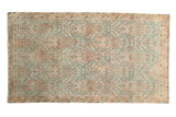 Distressed vintage Borchalou rug with low pile, faded allover design in sky blue and peach.