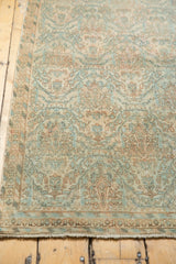Distressed vintage Borchalou rug, low pile texture, knot heads, peachy blush and sky blue.