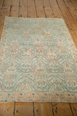 Vintage Borchalou rug with low, distressed pile, visible knot heads, and secured end.