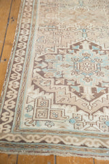 Distressed Serab runner detail showing geometric motif and soft blue accent colors.