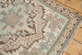 Distressed Serab runner showing geometric patterns, serrated leaves, beige, brown, and sky blue.