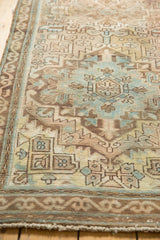 Distressed Serab runner, muted sandy beige, blue, brown geometric serrated leaf motifs.