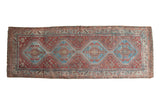 Distressed vintage Qashqai runner, aqua blue geometric medallions, muted red field. 3'8