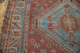 Distressed vintage Qashqai runner featuring aqua rams horn style medallion and serrated red border.