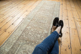 Distressed vintage Karaja runner, showing geometric vinery in antique ivory and brown.