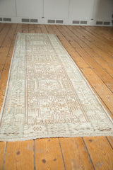Geometric vinery pattern and even wear on a vintage Karaja rug in ivory and brown.
