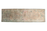 Distressed Serab rug runner with faded ivory, bronze, and dusty teal geometric medallions, 3'3
