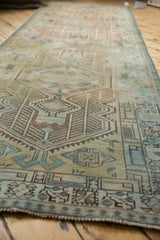 Reciprocating pawn motif border, geometric dusty teal and bronze Serab runner, with even wear.