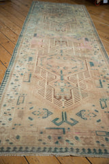 Distressed Serab runner showing muted ivory, teal, bronze geometric patterns, pawn border.
