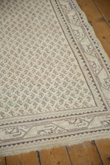 Distressed ivory fringe and charcoal chocolate brown geometric border of Mir Serbend runner.