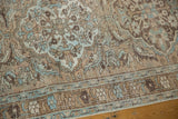 Intricate curvilinear florals and leaves on distressed Ahar runner in beige, brown, and powder blue.