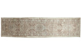 Distressed Serab runner with antique ivory, faded brown geometric medallions, pawn motif border.