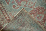 Distressed raspberry and blue pile with visible hand knotted foundation of a Malayer rug.