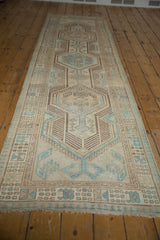 Distressed Serab runner corner, showing powder blue, beige geometric borders, fringe, and surface wear.