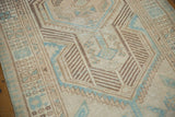 Distressed vintage Serab runner showing even wear across knot heads and geometric blue designs.
