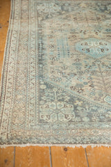 Distressed vintage Abadeh rug showcasing textured low pile, soft sky blue and antique ivory patterns.