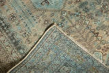 Vintage distressed Abadeh rug: low pile, visible knot heads, and hand-knotted foundation.