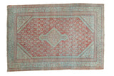 Distressed vintage Mir Serbend rug in faded cherry red and pale blue, central medallion and boteh field.