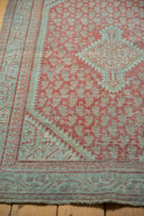 Distressed vintage Mir Serbend rug detail, cherry red boteh, pale blue tones, worn fringe.