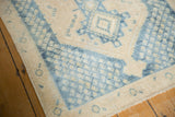 Close-up of distressed geometric pattern and even wear on vintage Sivas rug.