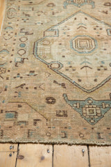Decorative distressed texture of vintage Hamadan rug, with low pile and geometric motifs.