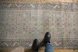 Distressed Hamadan runner detail showing worn neutral pile, allover heart motif, and serrated border.
