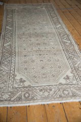 Distressed Hamadan runner, serrated leaf border, allover heart motif, and soft neutral palette.