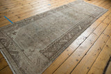 Distressed vintage Hamadan runner, featuring a serrated leaf border and heart motif.