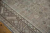 Distressed Hamadan runner with worn serrated border and subtle heart motifs.