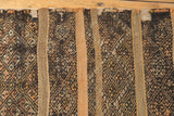 Braided fringe detail on a vintage Jijim rug runner with dense geometric pattern bands.