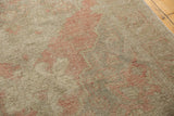 Distressed Oushak rug pile showing even wear and faint foundation through blush patterns.
