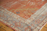 Distressed vintage Mahal rug detail highlighting brick red field, visible foundation, and slate blue border.