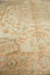 Distressed Oushak carpet texture, with antique ivory, muted gold, and oxidized silver patterns.