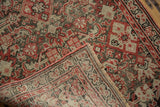 Hand-knotted foundation of an antique Malayer rug runner, folded to show worn Herati pile.
