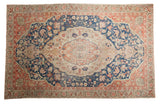 Vintage Distressed Sivas carpet, oversized ivory medallion, navy blue and blush floral field.