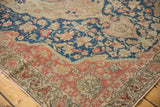 Vintage Distressed Sivas carpet corner with intricate blush and charcoal borders, showing even pile wear.